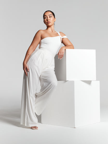 handmade in UK from sustainable sources eco rayon recycled viscose ivory pleated wide leg flared trouser that is high waisted lightweight breezy and versatile to wear across all seasons