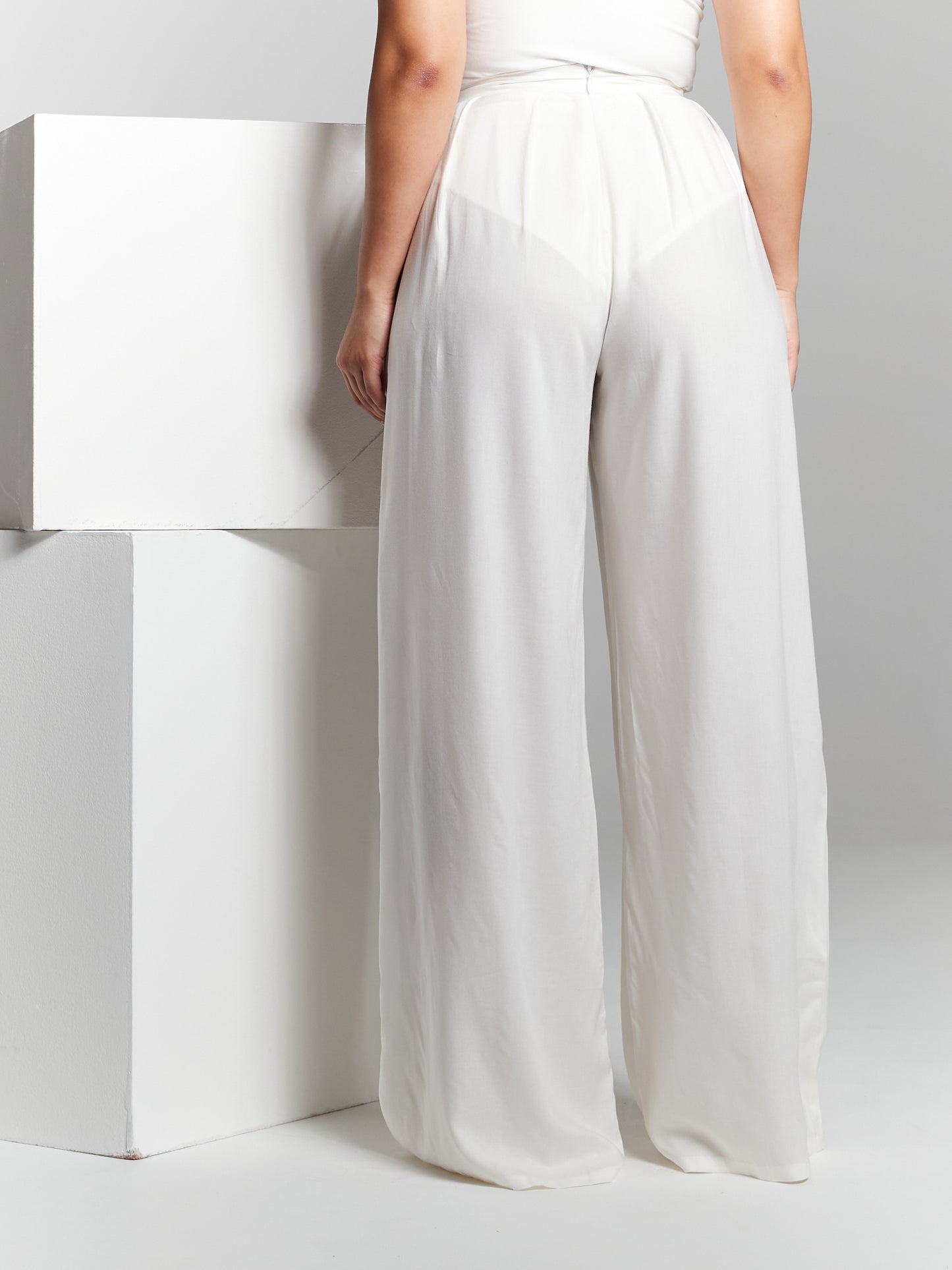 Elevate your sustainable style with our Eco Rayon Pleated Wide-Leg Trousers. These trousers offer a perfect blend of fashion-forward design and eco-conscious materials, making them a versatile addition to your wardrobe. Breezy style that can be customised to a leg length you prefer so you can wear it with heels to flats. Wide leg flared pants made from lightweight breathable recycled eco rayon viscose that is sustainable 