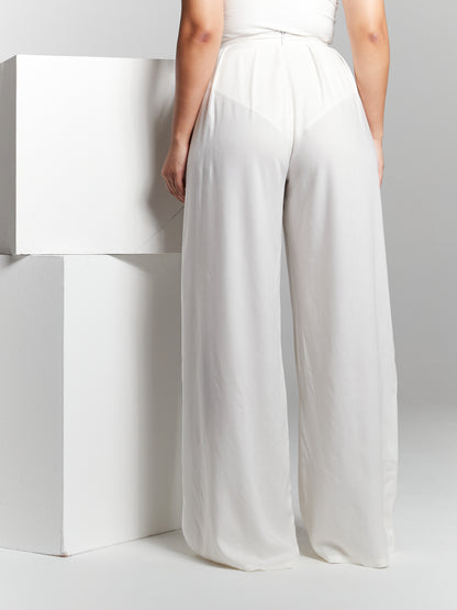 Elevate your sustainable style with our Eco Rayon Pleated Wide-Leg Trousers. These trousers offer a perfect blend of fashion-forward design and eco-conscious materials, making them a versatile addition to your wardrobe. Breezy style that can be customised to a leg length you prefer so you can wear it with heels to flats. Wide leg flared pants made from lightweight breathable recycled eco rayon viscose that is sustainable 