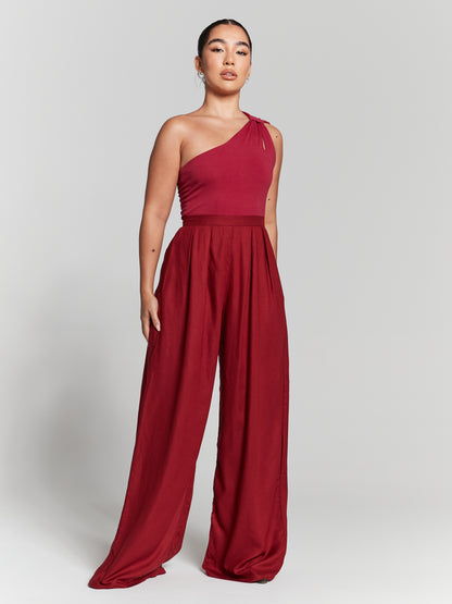 Burgundy High waisted pleated wide leg trousers. Maroon high rise box pleated wide leg straight flared trouser red high rise waist pressed pleats flared extra wide leg straight pants. invisible zip fastening non stretch flattering press wide waistband sits on your natural waist full length flared trousers Womens high rise pleated wide leg trouser ladies red pleated high waist wide leg flares. Choose sustainability without compromising on style. 